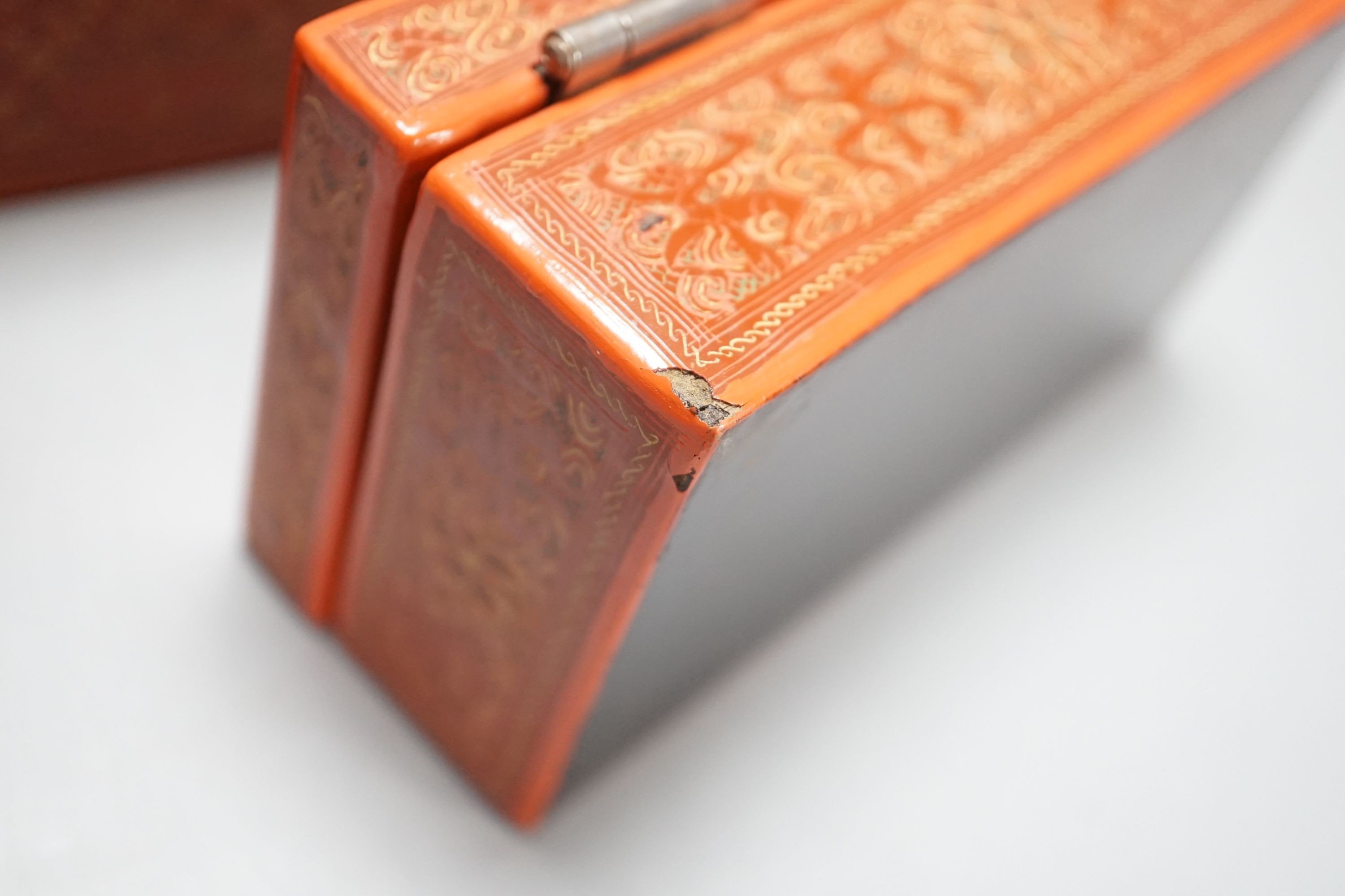 Three Burmese red lacquer graduated boxes, largest 21 cms wide.